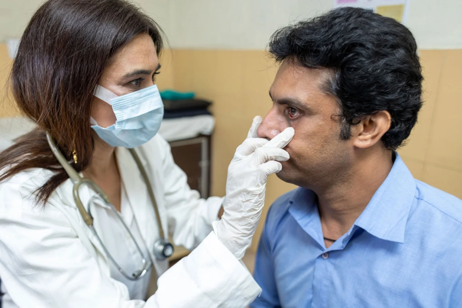 Doctor consulting with senior patient