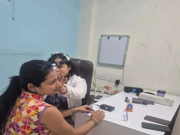 Dr. Mitva Agarwal examining a patient